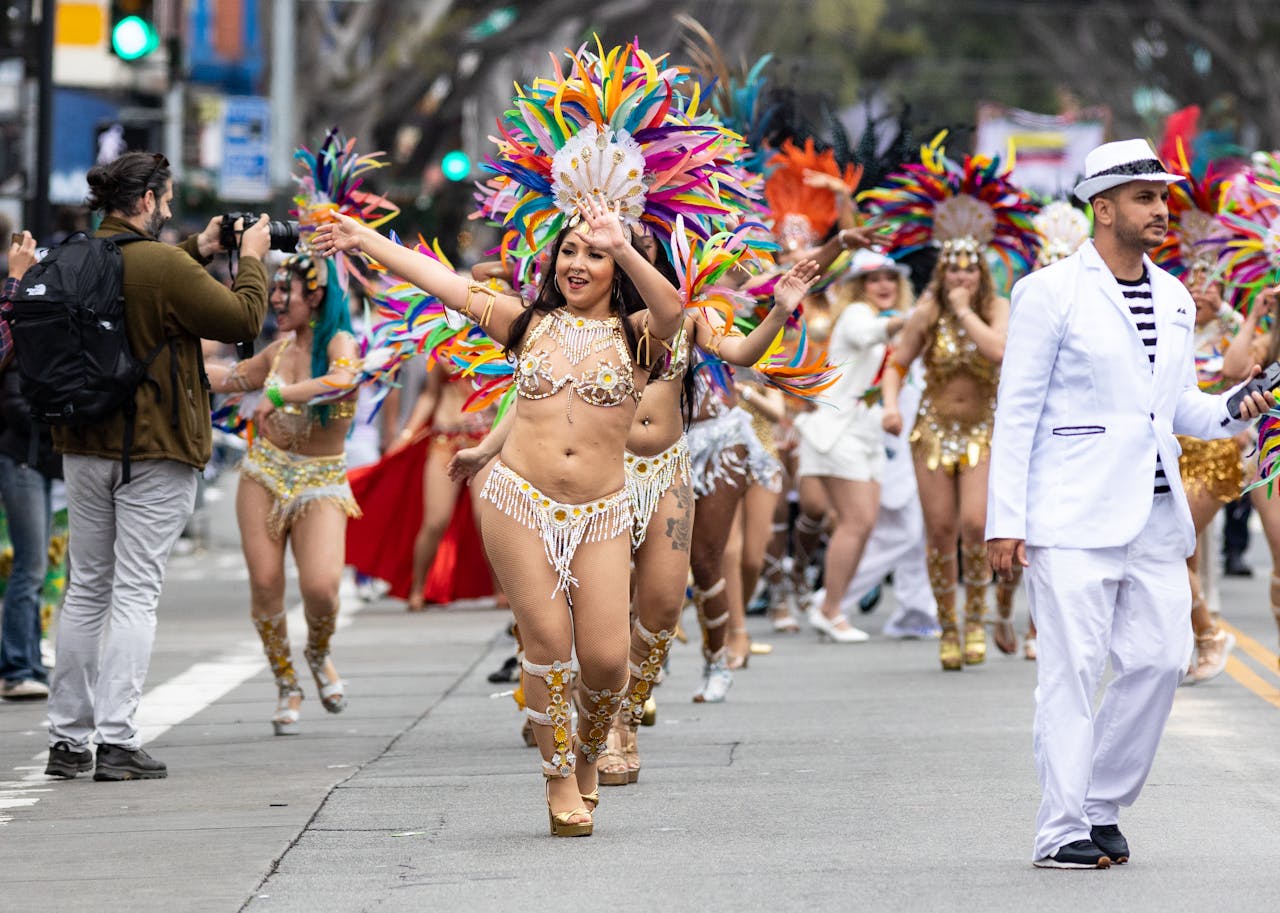 Costumed dancers and crowds enjoying the carnival parade atmosphere