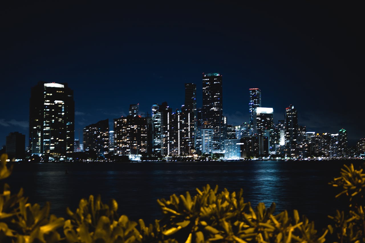 Sunset photo with Miami’s skyline reflecting on the water.