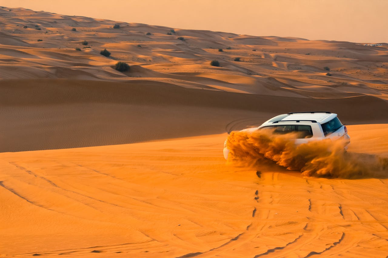 White Suv on Dubai Dessert