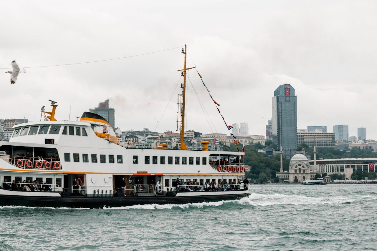 A boat on the Bosphorus with the cityscape in the background.